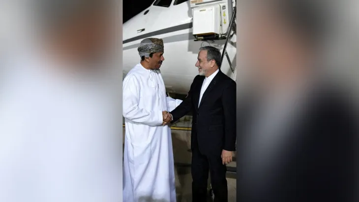 Iran's Foreign Minister Abbas Araqchi is welcomed by an Omani official upon his arrival in Muscat, Oman, in this handout image obtained on February 6, 2026. [West Asia News Agency via Reuters]