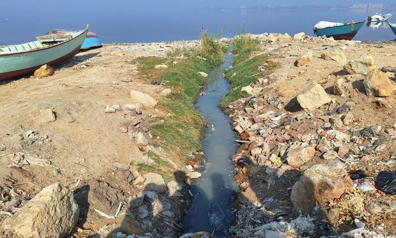 Sewage drainage channels run into the lake