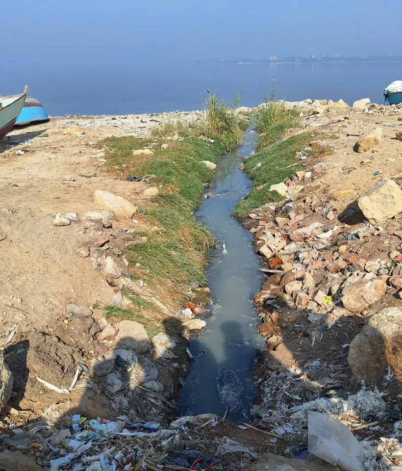 Sewage drainage channels run into the lake
