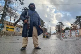 Security personnel stand guard on a road in Quetta, Pakistan