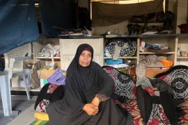 Kefaya Al-Assar, 73, from Jabalia in northern Gaza, in a classroom at Al Ezz Ben Abdelsalam School in Al Nusirat, [Ola al-Asi/Al Jazeera]